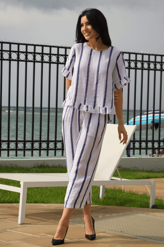 Women's white linen wide-leg pant set with navy vertical stripes – a chic and breathable two-piece outfit for effortless elegance.