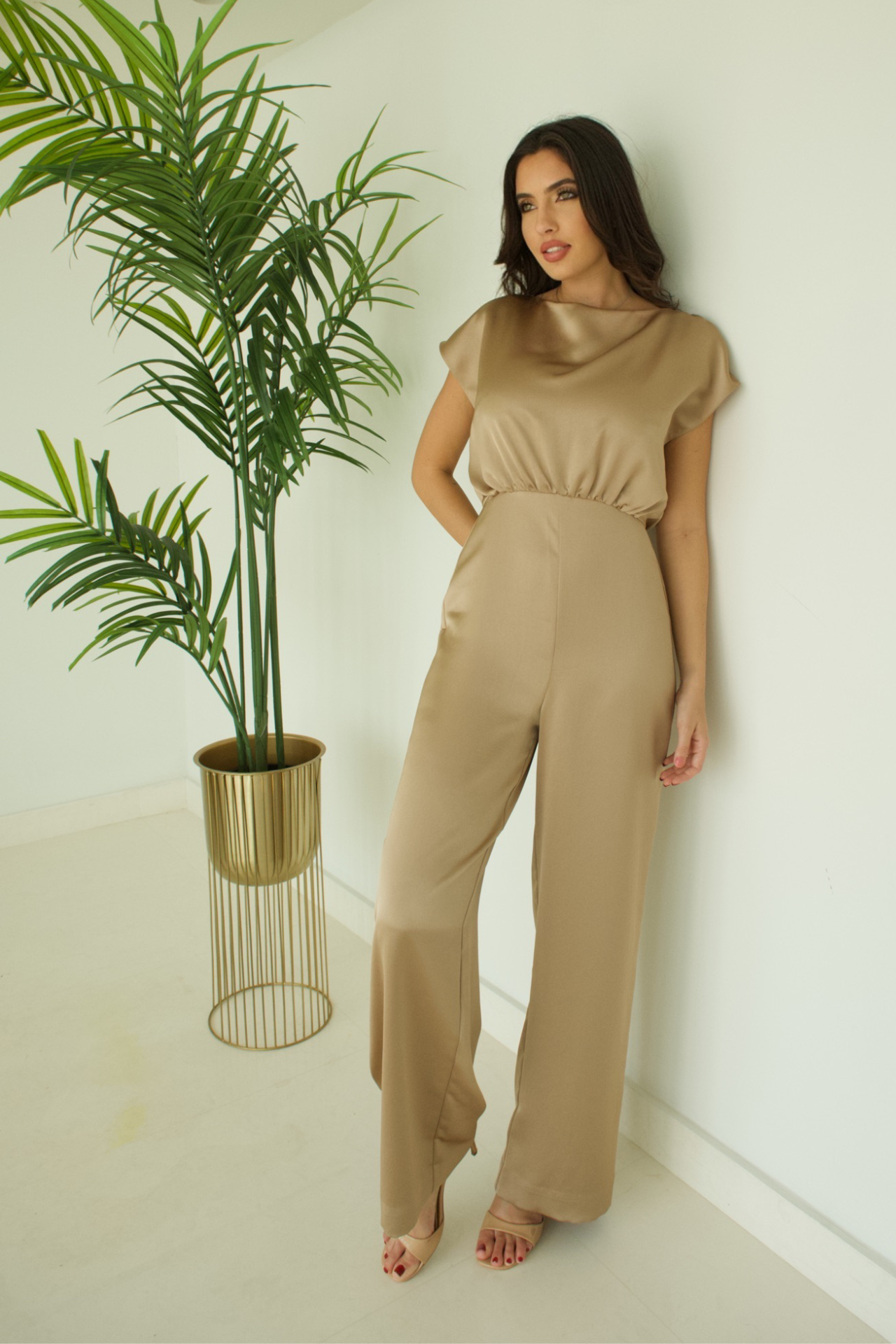 Front view of the Gold Soft Fabric Jumpsuit, featuring a luxurious gold hue and a flattering design for an elegant and comfortable party look.