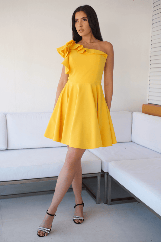 Showcasing elegance from every angle, this one-shoulder yellow cocktail dress highlights your silhouette with its flawless fit and vibrant ruffle design. 🌟 Perfect for standing out at any special occasion.