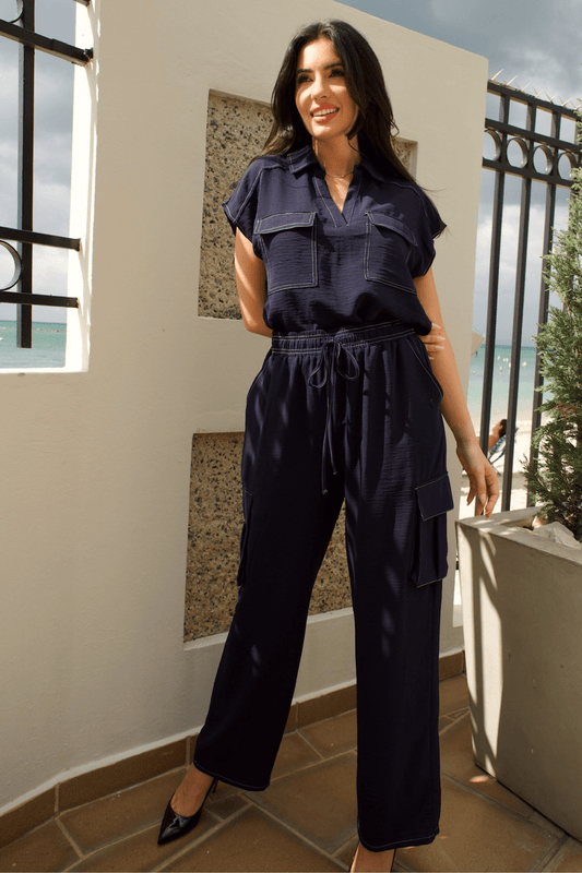 Women's navy cargo pant set with white stitch detail – a stylish and versatile two-piece outfit.
