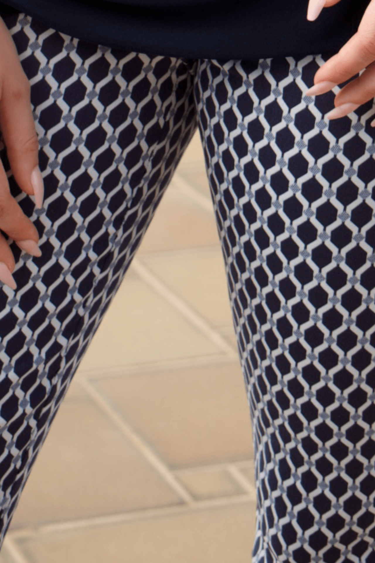 Detailed view of the navy and white hexagon print on women's pull-on pants, showcasing the modern geometric design.